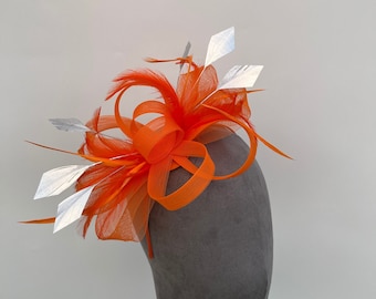 Orange loop bow fascinator with added Silver diamond trimmed feathers headband and clip