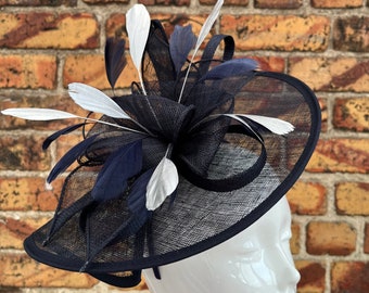 Large sinamay navy blue looped fascinator hatinator headband with added silver feathers