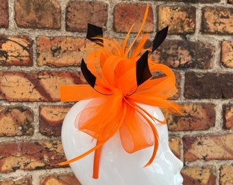 New orange loop bow fascinator with added black trimmed feathers headband and clip