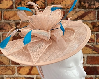 Large sinamay nude beige looped fascinator headband and clip with extra sky blue feathers