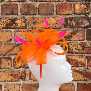 New bright orange loop bow fascinator headband and clip with orange and pink trimmed feathers