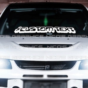 May include: White car with a custom text decal on the windshield that says "#CUSTOM TEXT".