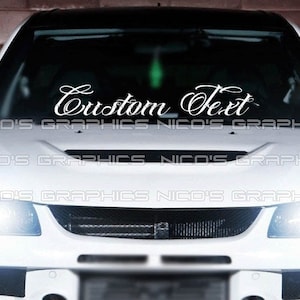 May include: White car with a white vinyl decal on the windshield that says "Custom Text".