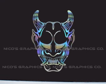 May include: A holographic sticker of a Japanese demon mask with horns and a fierce expression.