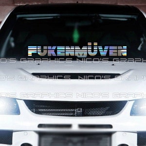 May include: A white car with a silver and blue iridescent sticker on the windshield that says "FUKENMÜVEN".