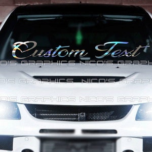 May include: A white car with a custom text decal on the windshield. The decal is iridescent and says "Custom Text".