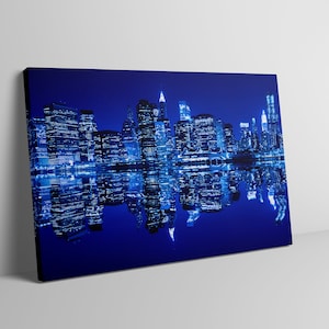 Lower Manhattan in New York City at night. Blue Hue Reflexion. City Art. Night light. Beautiful City at Night. City canvas. Art on Canvas.