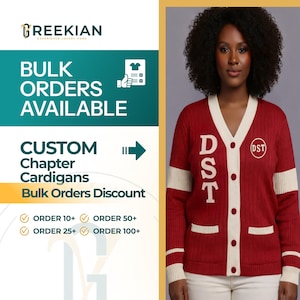 Op de afbeelding: Een rode cardigan met crèmekleurige accenten, met de letters "DST" en een cirkelvormig embleem. De cardigan heeft een V-hals, knoopsluiting en zakken. Tekst aan de linkerkant luidt "BULK ORDERS AVAILABLE" en "CUSTOM Chapter Cardigans".