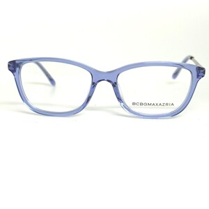 May include: A pair of light blue BCBGMAXAZRIA eyeglasses. The frames are a translucent, light blue color with a cat-eye shape. The brand name is printed on the right lens.