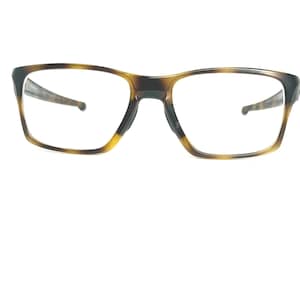 May include: A trio of ceramic mugs with a speckled, matte finish in cream, light grey, and dark grey. Each mug features a simple, minimalist design, ideal for tea or coffee.