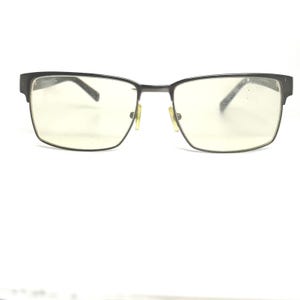 May include: Rectangular eyeglasses with a dark gray metal frame. The lenses are clear with a slight yellow tint. The glasses have a classic, minimalist design, suitable for everyday wear.
