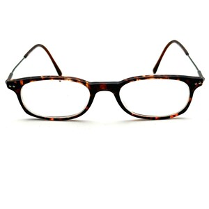 May include: Tortoiseshell reading glasses with a metal spring hinge.