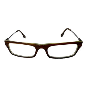 May include: Brown and gold rectangular eyeglasses with a metal frame.