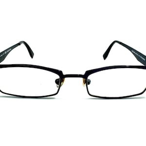 May include: Black rectangular eyeglasses with a thin metal frame.