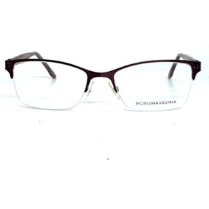 May include: BCBGMAXAZRIA eyeglasses with a half-rim design. The frames are a dark burgundy color, with a rectangular shape at the top and a thin metal frame. The brand name is printed on the lower right lens.