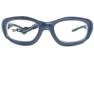 May include: A pair of dark blue, wraparound safety glasses with clear lenses.