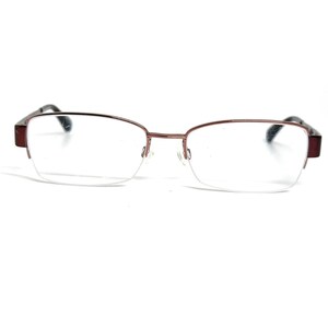 May include: Semi-rimless eyeglasses featuring a dark maroon metal frame. The lenses are clear and rectangular in shape with rounded edges. The thin metal bridge connects the two lenses, and the temples are dark maroon with black tips.