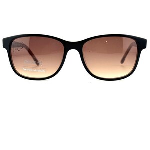 May include: Black rectangular sunglasses with brown lenses. The sunglasses have a "Petite Fit" label and say "Polarized Available".