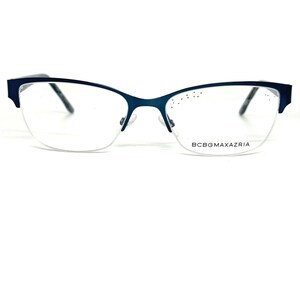 May include: A pair of blue metal frame eyeglasses with clear lenses. The brand name "BCBGMAXAZRIA" is printed on the bottom of the right lens.