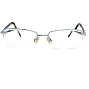 May include: Silver-toned half-rim spectacles with clear lenses.