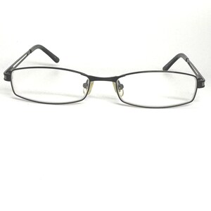 May include: Rectangular eyeglasses with a black metal frame. The lenses are clear, and the arms have a thin, angular design. The glasses are set against a white background.