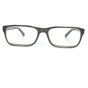 May include: Rectangular eyeglasses with a textured black frame and clear lenses. The temples are a muted green color. The glasses are set against a white background.