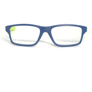 May include: Blue rectangular eyeglasses with clear lenses. The frames are a solid, matte blue. The glasses have a classic, modern design, suitable for everyday wear. The lenses are clear and ready for prescription.