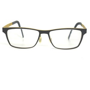 May include: Black rectangular eyeglasses with gold-colored accents on the temples and rims. The glasses have a minimalist design with a thin frame and clear lenses. The nose pads are a light yellow color.