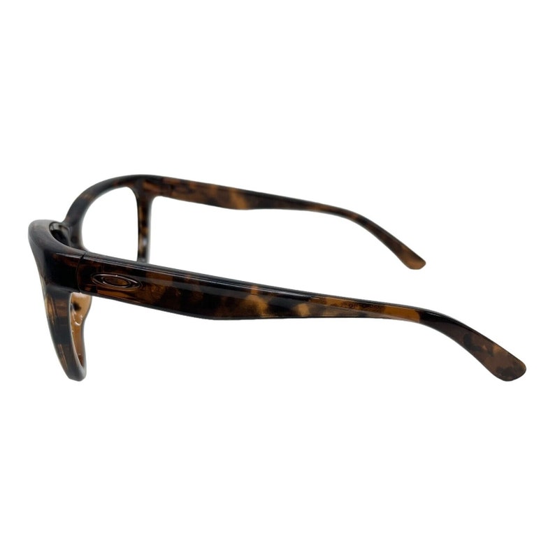 May include: Tortoise shell eyeglasses with a brown frame.