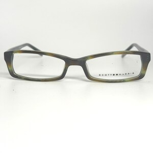 May include: Rectangular eyeglasses with a dark green and brown patterned frame. The lenses are clear, and the brand name "SCOTT HARRIS" is printed on the right lens. The glasses have a classic, professional design.