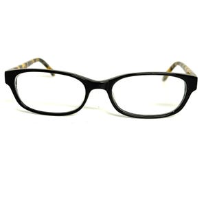 May include: Eyeglasses featuring a glossy black rectangular frame with clear lenses. The temples are designed with a brown and black tortoiseshell pattern, providing a contrast to the solid black front of the frame and the bridge.