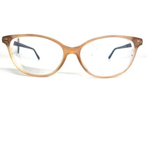 May include: A pair of brown tortoiseshell eyeglasses with clear lenses.