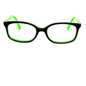 May include: Black eyeglasses with a green interior rim and green arms. The frames have a rounded rectangular shape. The glasses are set against a white background.