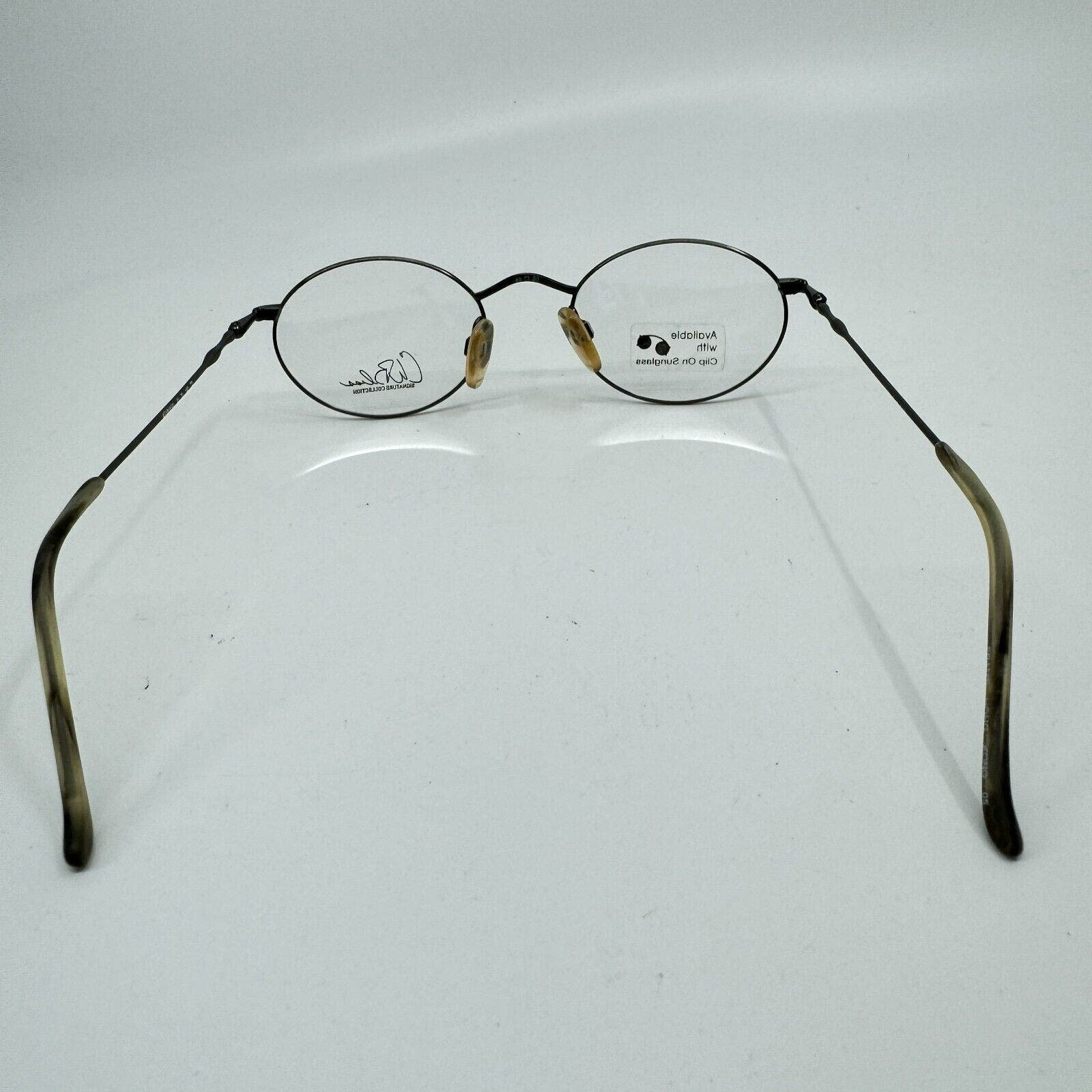 Kenmark Eyeglasses Frames Gallery Silver Round Tortoise 49-20-140 ...
