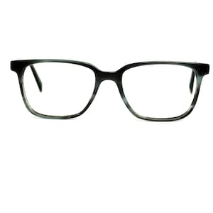 May include: A pair of eyeglasses with a dark gray and black marbled pattern on the frames. The lenses are clear, and the frames have a rectangular shape. The glasses are set against a white background.