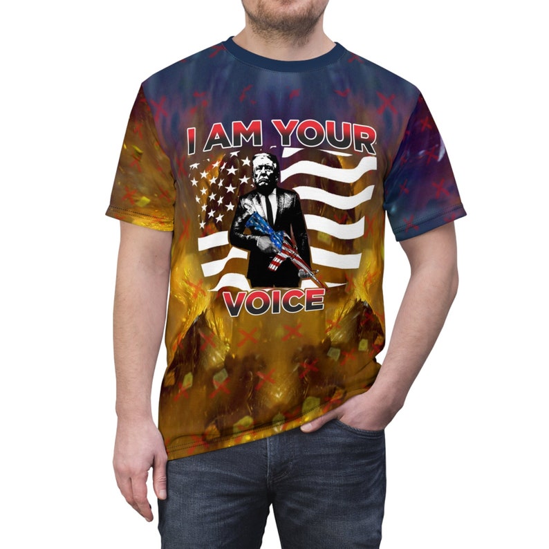 President Trump's "I Am Your Voice" and "Mug Shot" Unisex MAGA Lightweight T-Shirt is a peaceful rebellion against the political establishment, the legal system, the FBI, Hollywood know-it-alls, and their media sycophants.