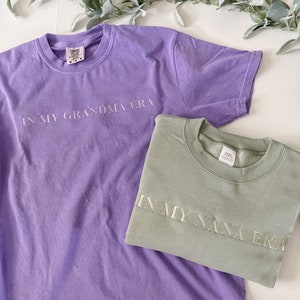 In my “custom” era t-shirt, sweatshirt monochromatic embroidered letters, in my mom era shirt, comfort colors T-shirt
