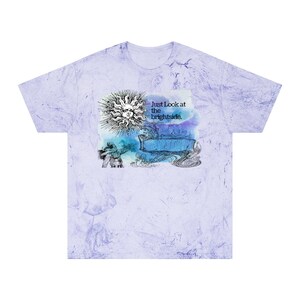 May include: A light purple tie-dye t-shirt with a graphic design featuring a sun, a banner with the text "Enjoy", and the text "Just Look at the brightside."