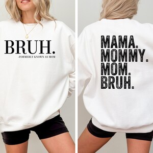 May include: White sweatshirt with black text that reads "BRUH." on the front and "MAMA. MOMMY. MOM. BRUH." on the back.