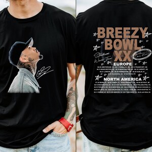 May include: Black t-shirt featuring a portrait of a man wearing a baseball cap, with a signature. The back of the shirt displays "Breezy Bowl XX" tour dates for Europe and North America.