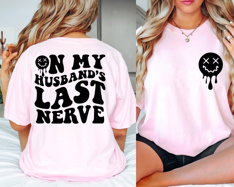 K&ouml;nnte beinhalten: Pinkes T-Shirt mit schwarzem Text, der "On My Husband's Last Nerve" lautet, und einem tropfenden schwarzen Smiley mit X f&uuml;r Augen.