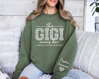 Custom Gigi Sweatshirt,With Kids Name On Sleeve, Gigi Sweater,Gigi Gift,Custom Grandma Gift, This Gigi Wears Her Heart On Her Sleeve Sweater