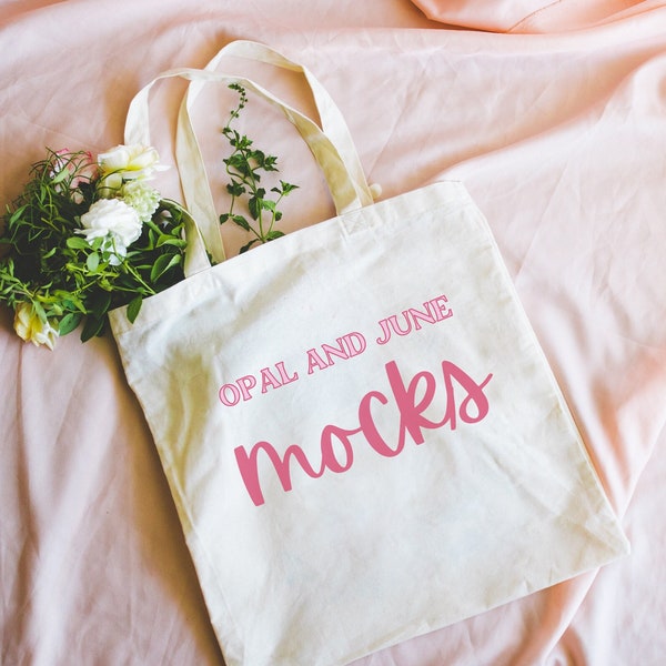 Cute Mockup of Port Authority Canvas Tote Bag | Natural Tote Mockup for Designers, Flat Lay Tote Photograph with Flowers, Pink Background