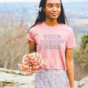 Outdoor Spring Mockup of Mauve Crop Top: Photo of Model Wearing Mauve Bella Canvas 8882 Crop Top Tee | Colorful Aesthetic Mock with Flowers