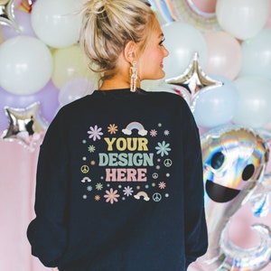 Back of Black Sweatshirt Mockup for Halloween: Colorful Photo of Model Wearing Black Gildan 18000 Crewneck for Groovy Spooky Season and Fall