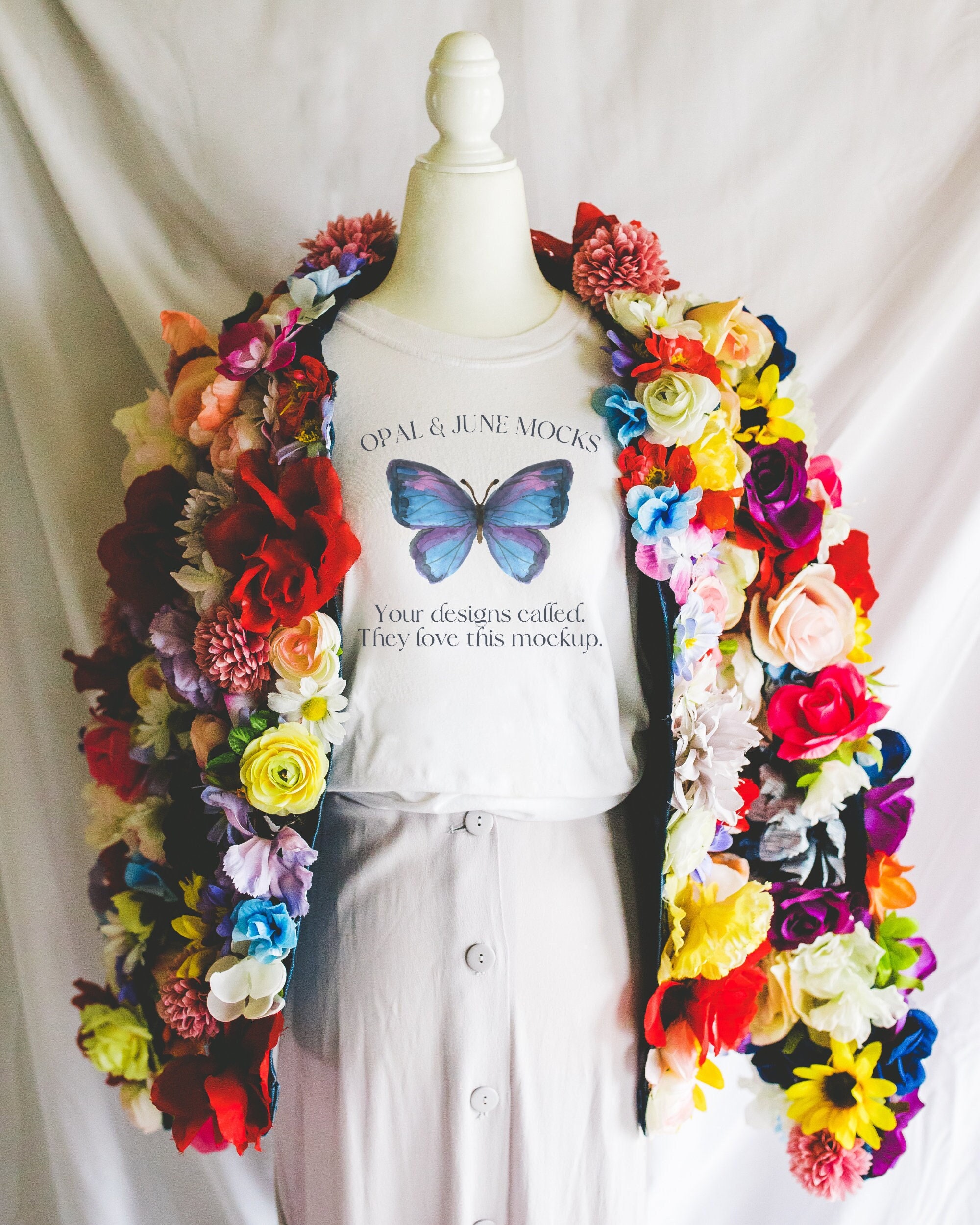 White Tee Shirt Mockup with Floral Aesthetic: Photo of Mannequin Wearing White Comfort Colors® Tee Shirt | Studio Mock of T-Shirt for Spring