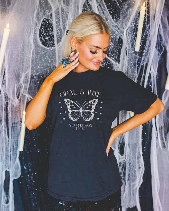 Black Shirt Mockup for Halloween with Spooky Candles: Photo of Model Wearing Black Comfort Colors® 1717 Tee Shirt | Colorful Mockup for Fall