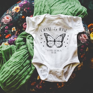 White Baby Bodysuit Mockup: Photo of Rabbit Skins 4424 Infant Fine Jersey Bodysuit | Cute Flatlay Mockup, Dark Cottagecore and Bookish Vibes