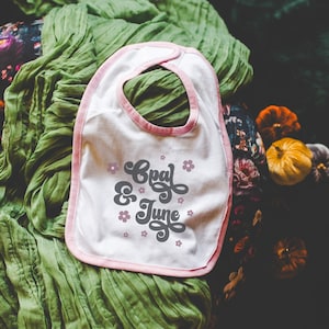 Baby Bib Mockup: Colorful Photo of Rabbit Skins 1004 Pink and White Jersey Bib | Cute Whimsigoth Mockup for Fall, Cottagecore Mock of Bib