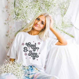 Mockup of Tee Shirt with Boho Bridal Aesthetic and Flowers: Model Wearing Comfort Colors® 1717 Tee Shirt | Oversized White T Mock for Spring